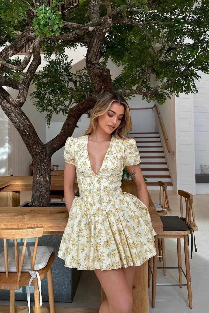 Yellow floral mini dress with tied back summer garden