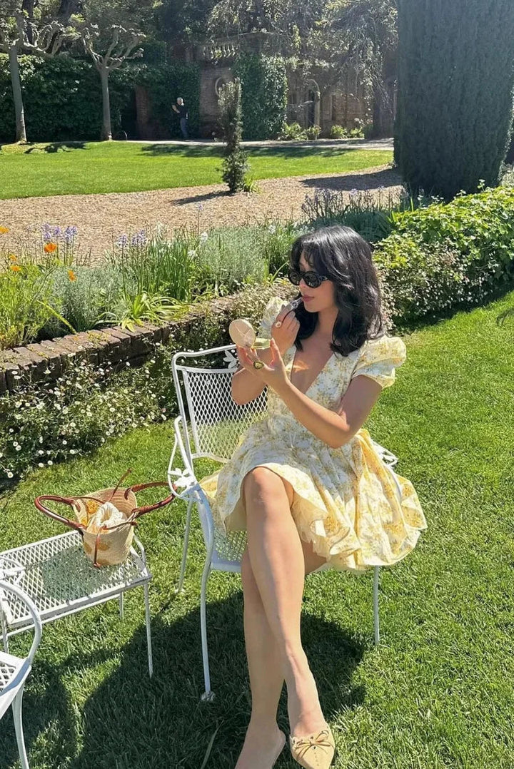 Yellow floral mini dress with tied back summer garden