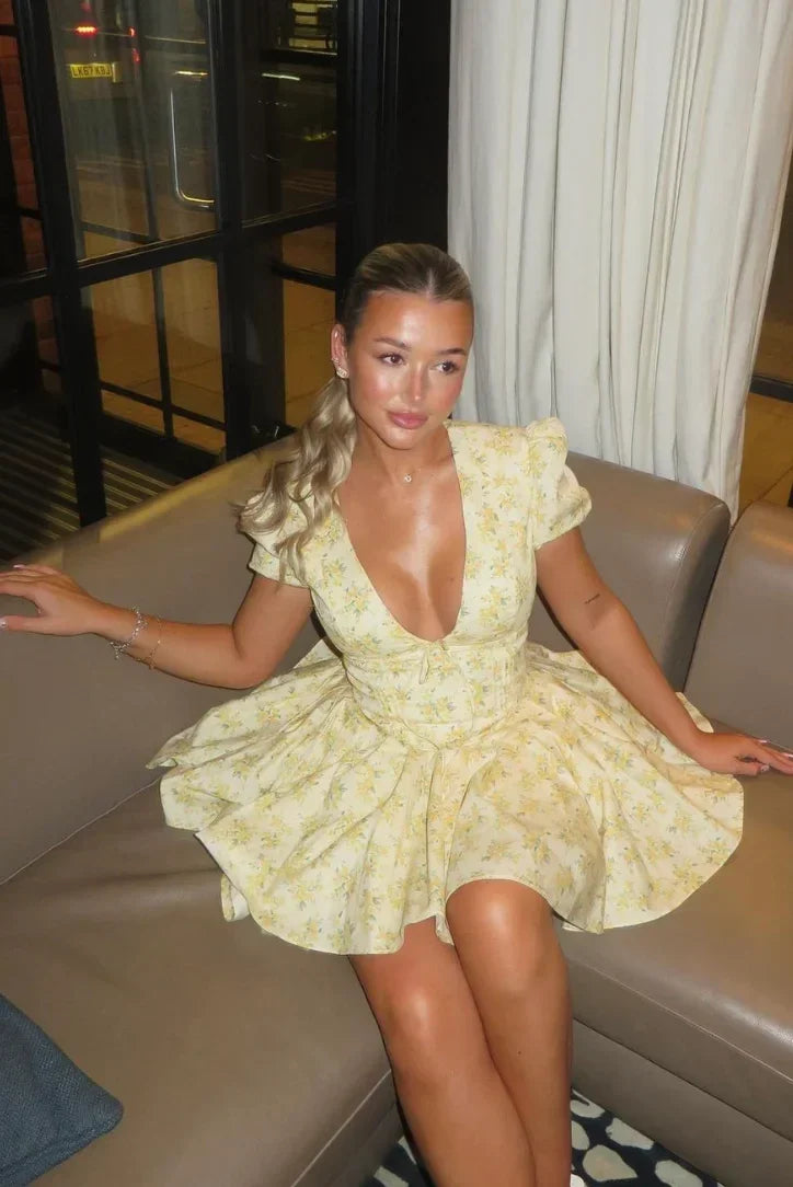Yellow floral mini dress with tied back summer garden